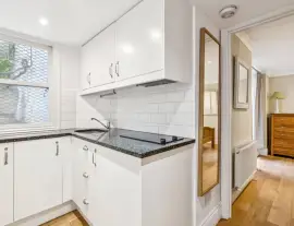 An absolutely charming four-bedroom house with a very private terrace, garden, and basement apartment, ideal in…