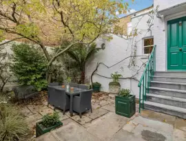 An absolutely charming four-bedroom house with a very private terrace, garden, and basement apartment, ideal in…