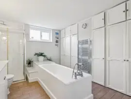 An absolutely charming four-bedroom house with a very private terrace, garden, and basement apartment, ideal in…