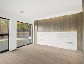 A state-of-the-art new building in a quiet cul-de-sac with spacious side living areas, outstanding design quality and