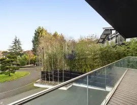 A state-of-the-art new building in a quiet cul-de-sac with spacious side living areas, outstanding design quality and