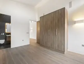 A state-of-the-art new building in a quiet cul-de-sac with spacious side living areas, outstanding design quality and