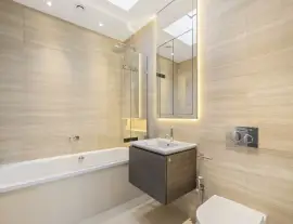 A state-of-the-art new building in a quiet cul-de-sac with spacious side living areas, outstanding design quality and