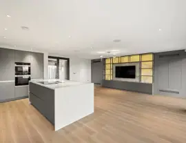 A state-of-the-art new building in a quiet cul-de-sac with spacious side living areas, outstanding design quality and