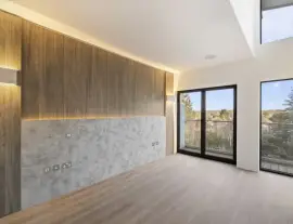 A state-of-the-art new building in a quiet cul-de-sac with spacious side living areas, outstanding design quality and