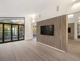 A state-of-the-art new building in a quiet cul-de-sac with spacious side living areas, outstanding design quality and