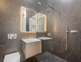 A state-of-the-art new building in a quiet cul-de-sac with spacious side living areas, outstanding design quality and