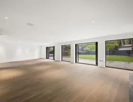 A state-of-the-art new building in a quiet cul-de-sac with spacious side living areas, outstanding design quality and