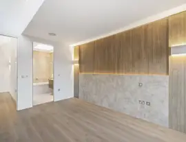 A state-of-the-art new building in a quiet cul-de-sac with spacious side living areas, outstanding design quality and