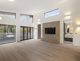 A state-of-the-art new building in a quiet cul-de-sac with spacious side living areas, outstanding design quality and