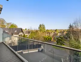 A state-of-the-art new building in a quiet cul-de-sac with spacious side living areas, outstanding design quality and