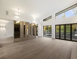 A state-of-the-art new building in a quiet cul-de-sac with spacious side living areas, outstanding design quality and