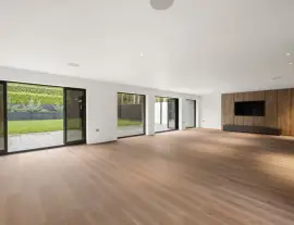 A state-of-the-art new building in a quiet cul-de-sac with spacious side living areas, outstanding design quality and