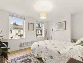 A stunningly renovated four-bedroom house in a quiet residential street with a south-facing garden.