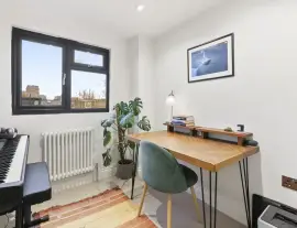 A stunningly renovated four-bedroom house in a quiet residential street with a south-facing garden.