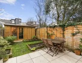 A stunningly renovated four-bedroom house in a quiet residential street with a south-facing garden.