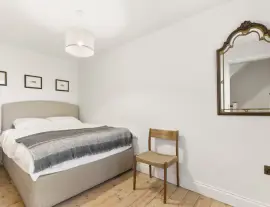 A stunningly renovated four-bedroom house in a quiet residential street with a south-facing garden.