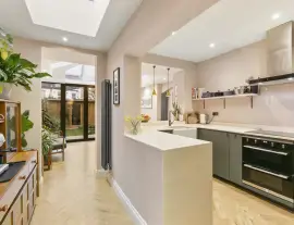 A stunningly renovated four-bedroom house in a quiet residential street with a south-facing garden.