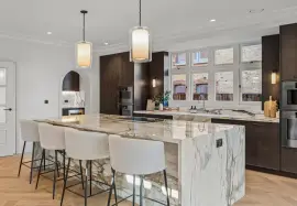 A newly built detached house with six bedrooms, spa, cinema and landscaped gardens.