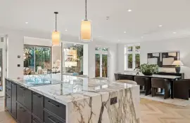 A newly built detached house with six bedrooms, spa, cinema and landscaped gardens.