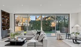 A newly built detached house with six bedrooms, spa, cinema and landscaped gardens.