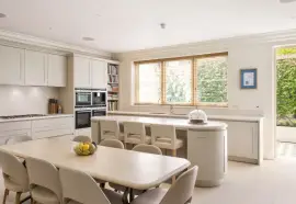 A lavish townhouse with a white stucco facade in Belgravia.