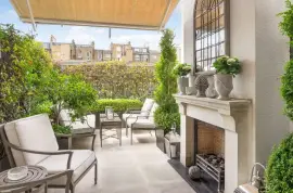 A lavish townhouse with a white stucco facade in Belgravia.
