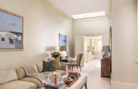 A lavish townhouse with a white stucco facade in Belgravia.