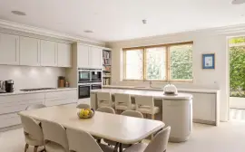 A lavish townhouse with a white stucco facade in Belgravia.