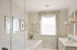 A lavish townhouse with a white stucco facade in Belgravia.