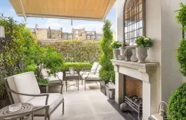 A lavish townhouse with a white stucco facade in Belgravia.