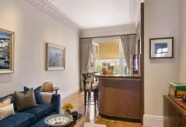 A lavish townhouse with a white stucco facade in Belgravia.