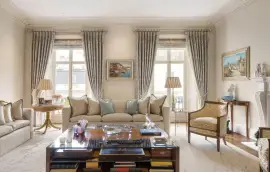 A lavish townhouse with a white stucco facade in Belgravia.