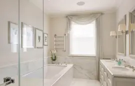 A lavish townhouse with a white stucco facade in Belgravia.