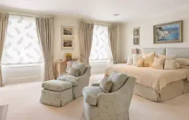 A lavish townhouse with a white stucco facade in Belgravia.