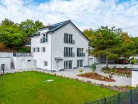 Premium three‑storey family home for sale in the green residential area of Budaörs, fully renovated