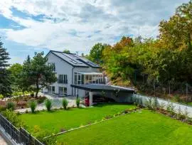 Premium three‑storey family home for sale in the green residential area of Budaörs, fully renovated