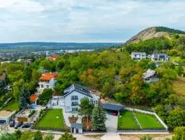 Premium three‑storey family home for sale in the green residential area of Budaörs, fully renovated